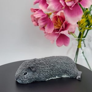 Sleeping grey guinea pig figurine