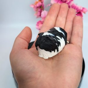 Black & white long hair guinea pig sculpture
