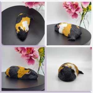 Sleeping black/ginger/white guinea pig figurine