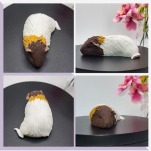 Sleeping white & brown guinea pig figurine