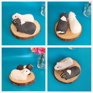 mini white and grey guinea pigs sculptures