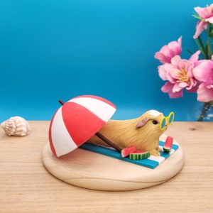 Beach ready Summer Guinea Pig Sculpture , made of polymer clay.