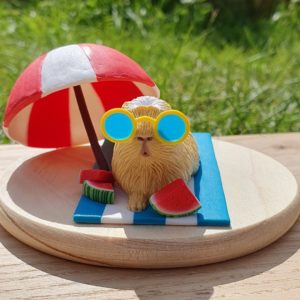 Beach ready Summer Guinea Pig Sculpture , made of polymer clay.